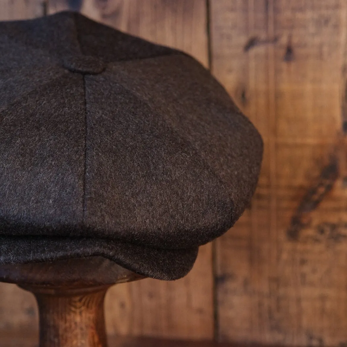 Eight Piece Faded Brown Wool Newsboy Cap