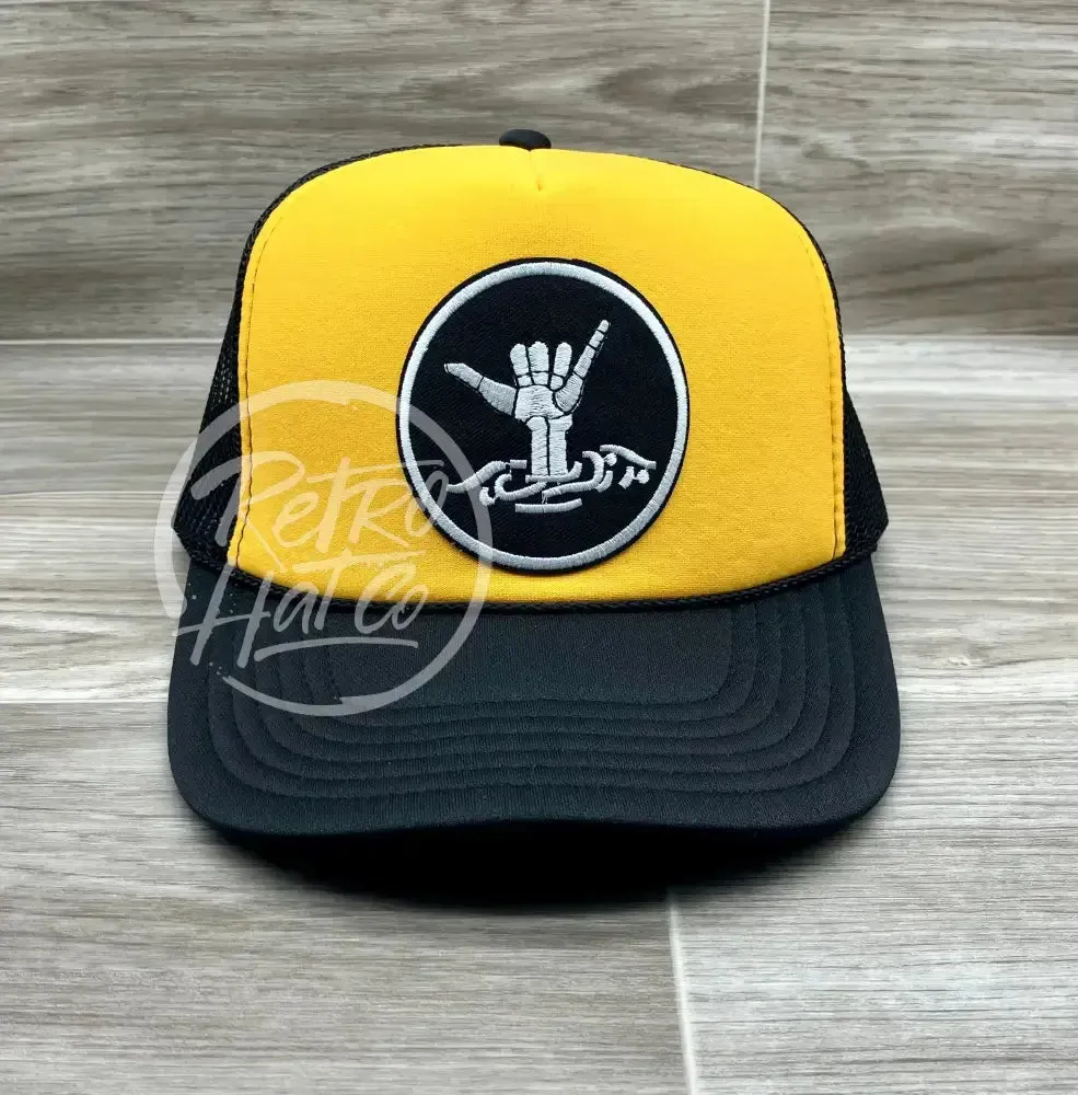 Hang Loose / Shakra Skeleton Patch on Gold/Black Trucker Hat with Snapback